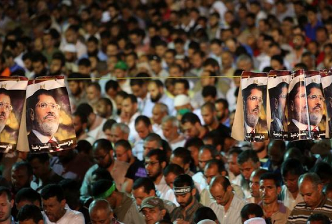 Gāztā prezidenta Muhameda Mursi atbalstītāji aizlūdz. Foto: EPA/LETA