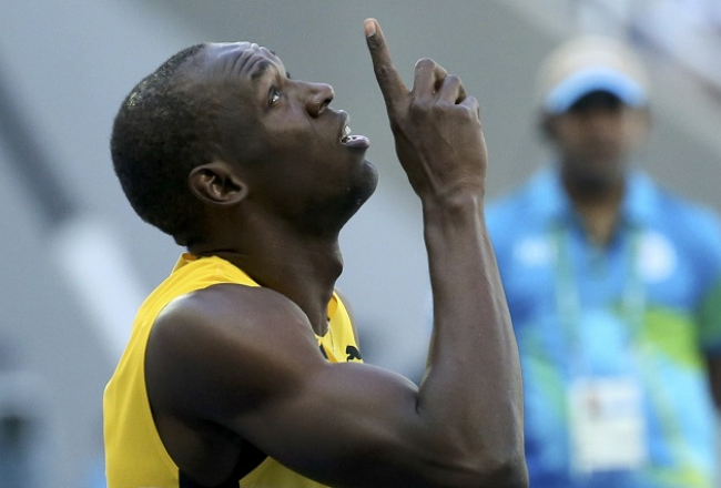Useins Bolts pēc finiša. Foto: Reuters/LETA
