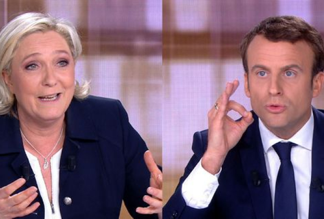 Francijas prezidenta amata kandidāti Marine Lepēna un Emanuels Makrons TV debatēs. Attēls: AFP-LETA