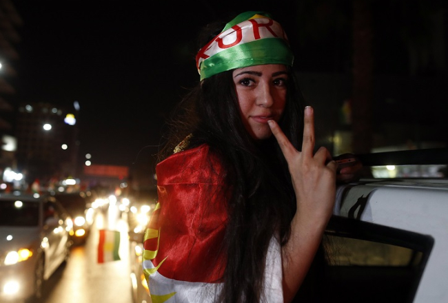 Irākas kurdu sieviete priecājas par Kurdistānas referenduma rezultātu. Foto: EPA/LETA