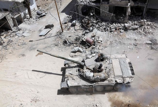 Sīrijas valdības armijas spēki Austrumgutas pilsētā Dumā. Foto: AFP/LETA