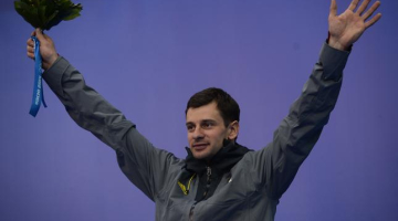 Foto: AFP. Latviešu skeletonists Martins Dukurs izcīna sudrabu Soču olimpiskajās spēlēs.