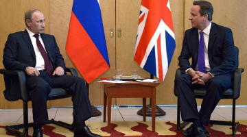 Krievijas prezidents Vladimirs Putins tiekas ar britu premjerministru Deividu Kameronu. Foto: EPA/LETA