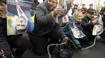 Ukraiņi protestē pret prezidentu Viktoru Janukoviču. Foto: AFP/LETA