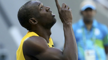 Useins Bolts pēc finiša. Foto: Reuters/LETA