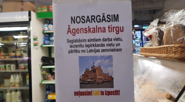 Protesta akcijas plakāts Āgenskalna tirgū. Publicitātes foto