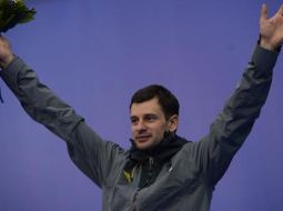 Foto: AFP. Latviešu skeletonists Martins Dukurs izcīna sudrabu Soču olimpiskajās spēlēs.