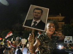 Sīrijā vēlētāji priecājas par Bašara al Asada ievēlēšanu prezidenta amatā. Foto: AFP/LETA