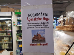 Protesta akcijas plakāts Āgenskalna tirgū. Publicitātes foto